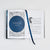 Open book spread featuring decorative title design, chapter ornamentations, and a dark blue ribbon bookmark