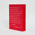 A red book in a designed slipcase standing upright on a light gray studio background, with white handwritten-style text on the back cover and spine reading 'HIDDEN PICTURES' and 'JASON REKULAK'.