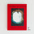 The Pit Edition of Jason Rekulak's 'Hidden Pictures' book, featuring a bright red cover with a central square black-and-white photograph of an opening from the ground and the artist's name printed in a textured font.